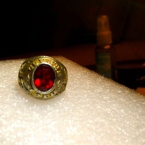 A red Stone ring with Golden cooler For The metal